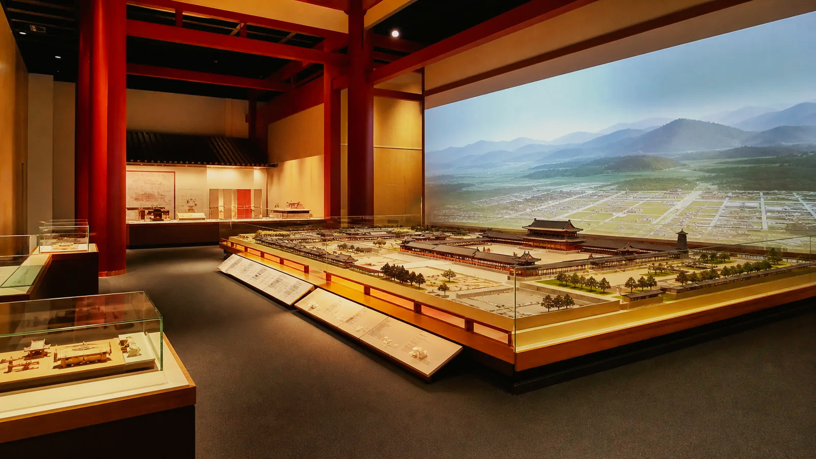 奈良時代の宮殿模型と大型映像を備えた無人の歴史展示室の編集イメージ